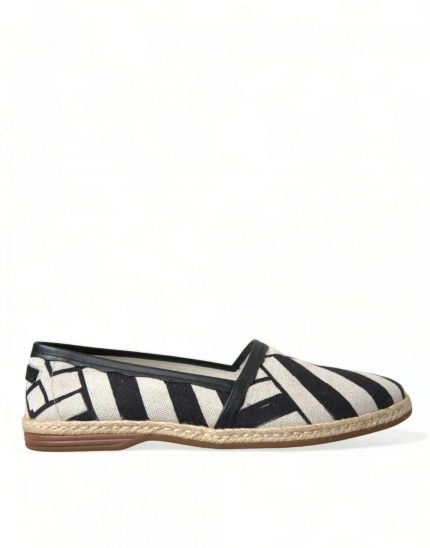 striped canvas espadrilles on a wooden surface, showcasing the elegant pattern and casual summer style.