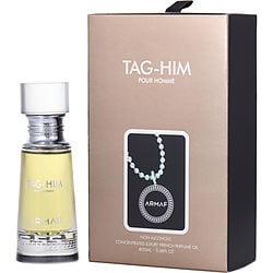 Armaf Tag-Him Pour Homme Perfume Oil 0.67 oz bottle displayed with vibrant accents of pink pepper and citrus elements.