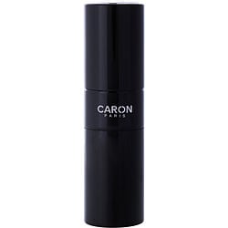 Elegant bottle of Caron Pour Un Homme perfume, featuring a sleek design with classic green and silver accents, symbolizing timeless sophistication and masculinity.